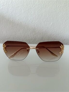 Women's polycarbonate sunglasses with 100% UV protection. NWOT